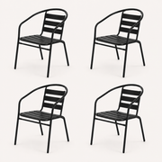 Studio | four black stacking patio armchairs at a three-quarter angle on a clean studio background