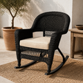 Mediterranean porch angle | espresso resin-wicker rocking chair with pale tan cushion and olive tree
