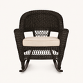Studio front | espresso resin-wicker rocking chair with pale tan seat cushion and curved rocker runners