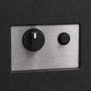Control detail | Brushed stainless control panel with black knob and push-button igniter