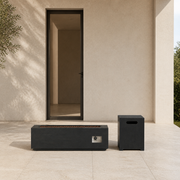 Scale | Fire table and square tank cover beside a full-height doorway