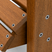 Stainless hardware | true close-up of circular washers, screw heads, and eucalyptus joinery