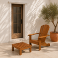 Scale | brown eucalyptus Adirondack chair and separate matching ottoman beside a full-height porch doorway