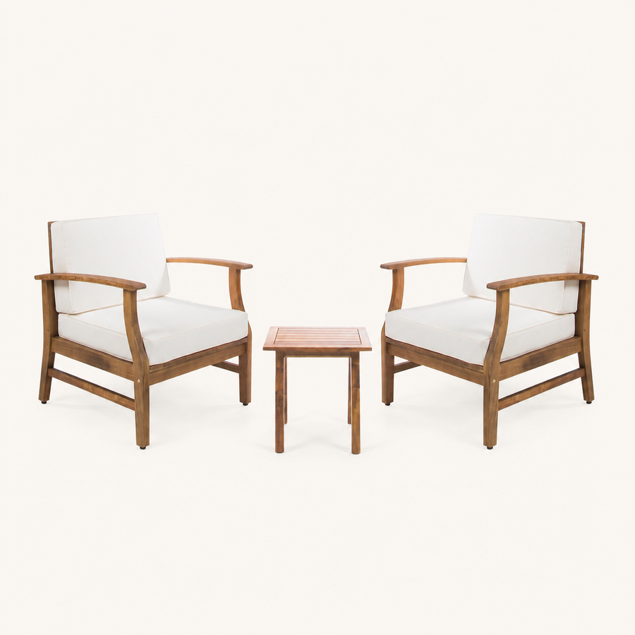 Front | Two warm-brown acacia club chairs with cream cushions and one slatted side table on clean studio ground
