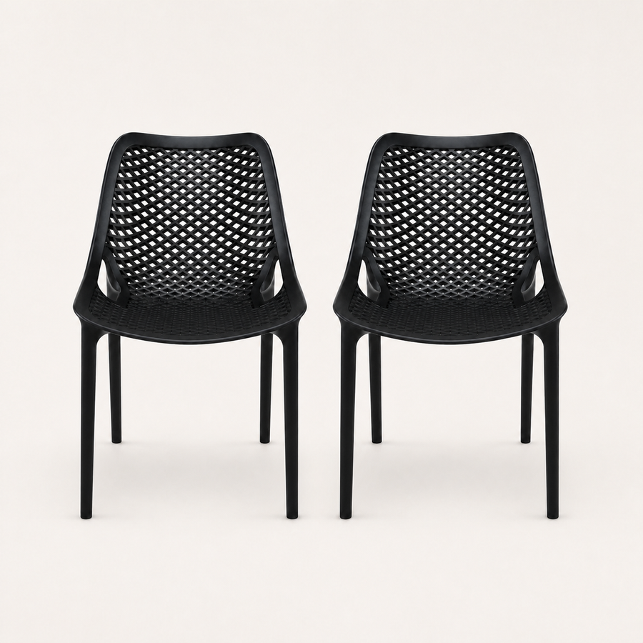 Studio front | Two matching Black perforated molded-plastic stacking chairs, straight-on
