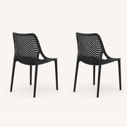 Studio side | Two Black stacking chairs in side and rear profile, showing shell depth and four legs each
