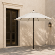 Scale view | open off-white octagonal umbrella beside a full-height exterior doorway