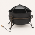 Studio three-quarter | Dark steel cauldron fire pit with muted dark bronze band, mesh screen, curled legs, and poker