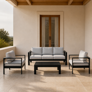 Doorway scale | black aluminum four-piece conversation set beside a full-height exterior doorway