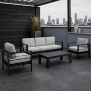 Cool rooftop terrace | black aluminum four-piece conversation set with light-gray cushions and slatted table