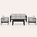 Studio front | black aluminum 3-seat sofa, two armchairs, and slatted coffee table with light-gray cushions