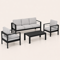 Studio three-quarter | black aluminum sofa, two armchairs, and slatted coffee table from a true angled view