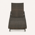 Front | foot-facing studio view of the dark woven chaise lounge with its raised backrest