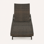 Front | foot-facing studio view of the dark woven chaise lounge with its raised backrest