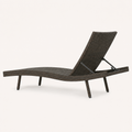 Side | side studio profile of the dark wicker chaise showing the curved seat and backrest
