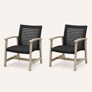 Studio three-quarter | Pair of light gray-washed acacia club chairs with dark open wicker seats and arched arms