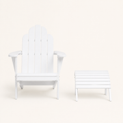Front | White Adirondack chair and separate matching ottoman on a warm white studio background