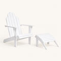 Studio angle | White Adirondack chair and matching ottoman from the front left on a warm white sweep