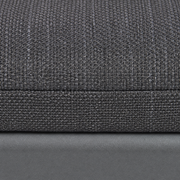 Cushion texture | Close view of dark gray woven cushion fabric, stitched edge and matte gray rail