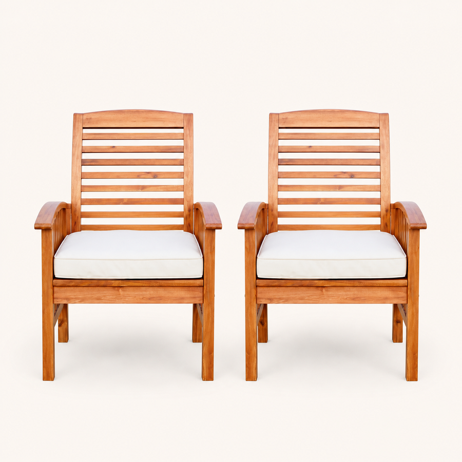 Front | pair of warm-brown acacia dining armchairs with ivory seat cushions facing forward on a clean studio backdrop