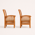 Side | side view of the pair of warm-brown acacia dining armchairs with ivory seat cushions