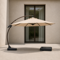 Scale | sand offset cantilever umbrella beside an uncropped full-height glass doorway, showing its scale with separate wheeled base