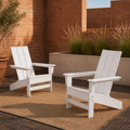 In a room | two white HDPE Adirondack chairs in a terracotta courtyard