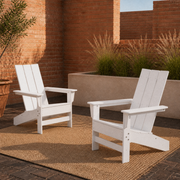 In a room | two white HDPE Adirondack chairs in a terracotta courtyard