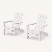 Studio | rear three-quarter studio view of two white HDPE Adirondack chairs showing slatted backs and arm depth