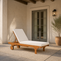 Covered patio scale view | full chaise beside an uncropped exterior doorway