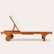 Studio profile | side elevation of the eucalyptus chaise with raised ratchet back, two wheels, and tucked tray