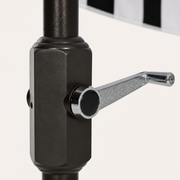Hardware | close view of the chrome crank handle and dark powder-coated pole housing