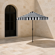 Scale | open umbrella beside a full-height arched patio doorway for scale