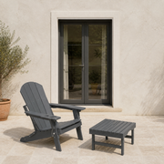 Scale | gray HDPE chair and ottoman beside an uncropped full-height exterior doorway
