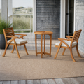 On a cedar porch | the two acacia armchairs and round table against blue-gray shingles