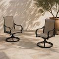 Terrace angle | two brown sling swivel dining armchairs on pale limestone pavers beside an olive in a terracotta pot