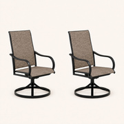 Studio three-quarter | two brown sling swivel dining armchairs showing seat depth, curved arms, and round bases