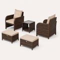 Side and rear studio view | two chairs, two ottomans, and glass-top table with chair backs visible