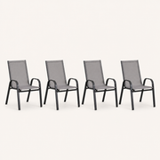 Side | four Gray stacking armchairs from a side studio angle, showing the curved arm profile and rear legs