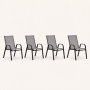 Studio | four Gray stacking armchairs in a clean three-quarter studio view, showing curved black arms and gray sling backs