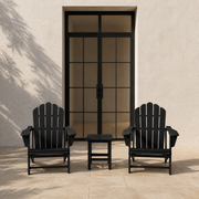 Scale | two black Adirondack chairs and black square side table beside a full-height black-framed patio door