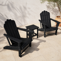 Three-piece black Adirondack chair set with square side table on limestone terrace