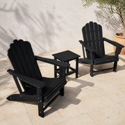 Three-piece black Adirondack chair set with square side table on limestone terrace
