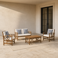Scale view | full conversation set on covered patio beside a floor-to-ceiling black-framed doorway