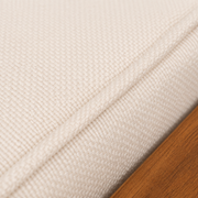 Cushion texture | beige woven cushion seam and acacia rail at macro scale