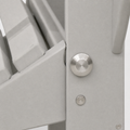 Folding hardware | tight macro of the brushed-metal pivot and light-gray folding bracket