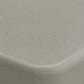 Texture | tight macro of the light-gray speckled surface and molded edge