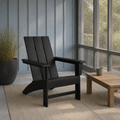 In a room | black HDPE Adirondack chair in a blue-gray screened porch beside a dark planter and teak table