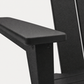 Texture | close view of the black HDPE armrest surface, pebbled texture, rounded edge, and adjacent back slat