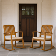 Scale | two rocking chairs on a porch beside an uncropped full-height doorway